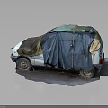 Old Abandoned Car With Damaged Body Covered In Blue And Brown Tarp On Gray Ground