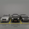 Indoor Parking Lot With Three Parked Cars And Yellow Parking Lines