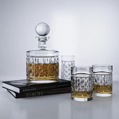 Crystal Glass Decanter And Glasses Filled With Amber Liquid On Stacked Books 3d model