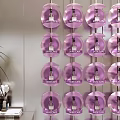 Modern Display Shelf with Neatly Arranged Purple Bottles and Product Labels