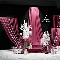 Elegant Wedding Decoration Setup With Red Curtains White Chandelier And Floral Arrangements Against Black Backdrop