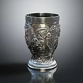Silver Decorative Metal Cup With Intricate Carved Patterns And Ornate Base Design