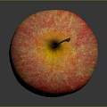 Fresh Shiny Red Apple With Yellow Stripes On Dark Reflective Surface