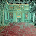 Luxurious Grand Hall Interior With Red Carpet Golden Columns Chandelier Fireplace And Paintings
