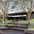 Modern Residential Landscape Entrance Featuring Stone Steps Sculpture And Lush Green Plants
