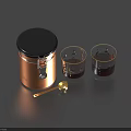 Tableware Set Including Brown Jar With Black Lid Two Gold Rimmed Glasses And Gold Spoon
