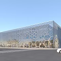 Modern Office Building With Honeycomb Patterned Metal Facade Glass Windows And Urban Street View