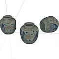 Set of Three Traditional Blue and White Ceramic Jars with Ornate Decorative Patterns