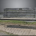 Natural Setting With Weathered Wooden Bench And Metal Armrests On Brick Pavement