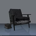 Modern Black Hinged Door Design With Armchair And Stack Of Books