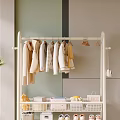 White Metal Clothes Rack Hanging Light Colored Garments With Lower Shelf Storage In Modern Interior