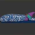Blue Cushion Featuring White Geometric Pattern And Small Doll With Pink Hat