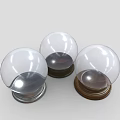 Decorative Ornament Set Featuring Transparent Glass Balls on Wooden and Metal Bases