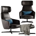 Black Leather Office Chair With Modern Design Navy Blue Pillow And Checkered Blanket