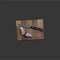 Sliced Purple Onion On Wooden Cutting Board With Black Handle Knife