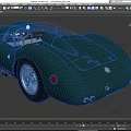Green Classic Open Top Sports Car With Streamlined Bodywork And Vintage Design