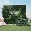 Green Plant Wall with Pink Rabbit Doll Light Blue Bicycle and Small Potted Plants