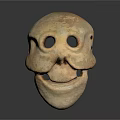 Ancient Clay Mask Featuring Prominent Eye Holes And Primitive Facial Design