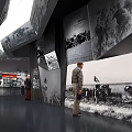 Historical Exhibition Hall Interior With Black White Photos Figure Models And Red Decorations