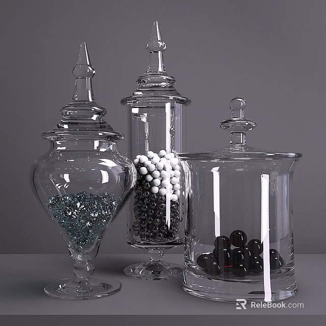 Clear Glass Vases With Lids Containing Decorative Balls And Pebbles On Gray Surface 3d model 