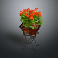 Orange Flower Plant With Green Leaves On Black Metal Decorative Stand