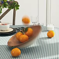 Round Dining Table Set With Striped Tablecloth Fruits Plants And Wooden Chairs With Woven Seats