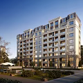 Elegant Mid Rise Residential Building With Modern Facade And Landscaped Gardens