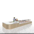 Modern Service Counter With White Countertop Gold Stripes And Dessert Display Cases