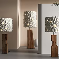 Modern Floor Lamps With Pebble Decorated White Shades Wooden Irregular Bases And Green Plant Accents