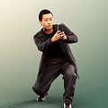 Man Crouching In Black Coat Holding Smartphone Against Green Background