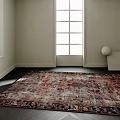 Stylish Rug With Vibrant Colorful Pattern In Modern Room With Large Window And Dark Flooring