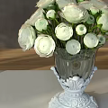 Transparent Glass Vase With White Carved Base Displaying Fresh White Flowers On Table