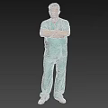 Man in Light Green Scrubs Standing with Arms Crossed Against Gray Background