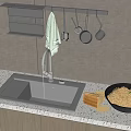 Stainless Steel Kitchen Sink with Faucet Drain Rack and Hanging Utensils on White Countertop