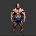 Muscular Man Standing with Well Developed Physique in Blue Shorts Against Gray Background