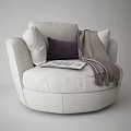 Comfortable Beige Single Sofa with Purple Pillow Gray Throw Blanket and Open Magazine