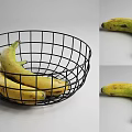 Fresh Ripe Yellow Bananas in Black Wire Basket on Gray Background