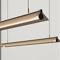 Modern Long Pendant Lights with Woven Shade and Metal Frame Hanging in Interior Space