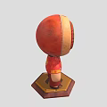Traditional Character In Red Outfit With Circular Head And Golden Pattern On Wooden Base