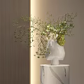 Elegant White Head Shaped Vase With Green Branches And Leaves On Marble Pedestal