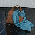 Brown Quilted Handbag with Blue Scarf on Black Glossy Floor against Leaf Pattern Wallpaper