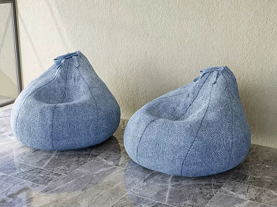 Two Blue Denim Bean Bag Chairs on Gray Marble Floor with Light Colored Wall 3d model