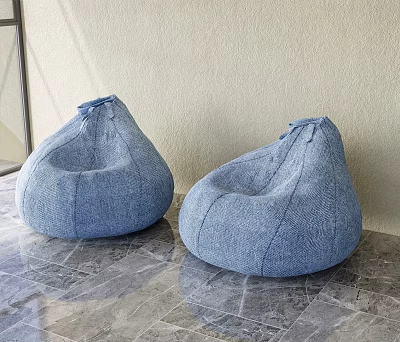 Two Blue Denim Bean Bag Chairs on Gray Marble Floor with Light Colored Wall 3d model