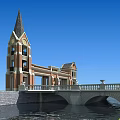 Red Brick Entrance Gate With Steeple Tower Stone Bridge And Waterfront View