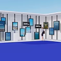 Modern Exhibition Space With Multiple Digital Screens And Person Walking On Blue Floor