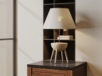 Modern Table Lamp with White Lampshade and Beige Three Legged Base on Dark Countertop and Bookshelf 3d model