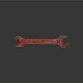Red Rustic Wrench Tool With Metallic Finish On Dark Background