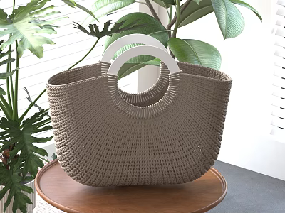 Chic Wicker Tote Bag With Circular Handle Placed On Wooden Table Near Plants 3d model