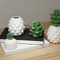 White And Green Pineapple Shaped Decorative Ornament Set On Stacked Books For Wooden Tabletop Decoration