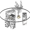 Modern Round Glass Top Coffee Table With Marble Legs And Decorative Vase And Books